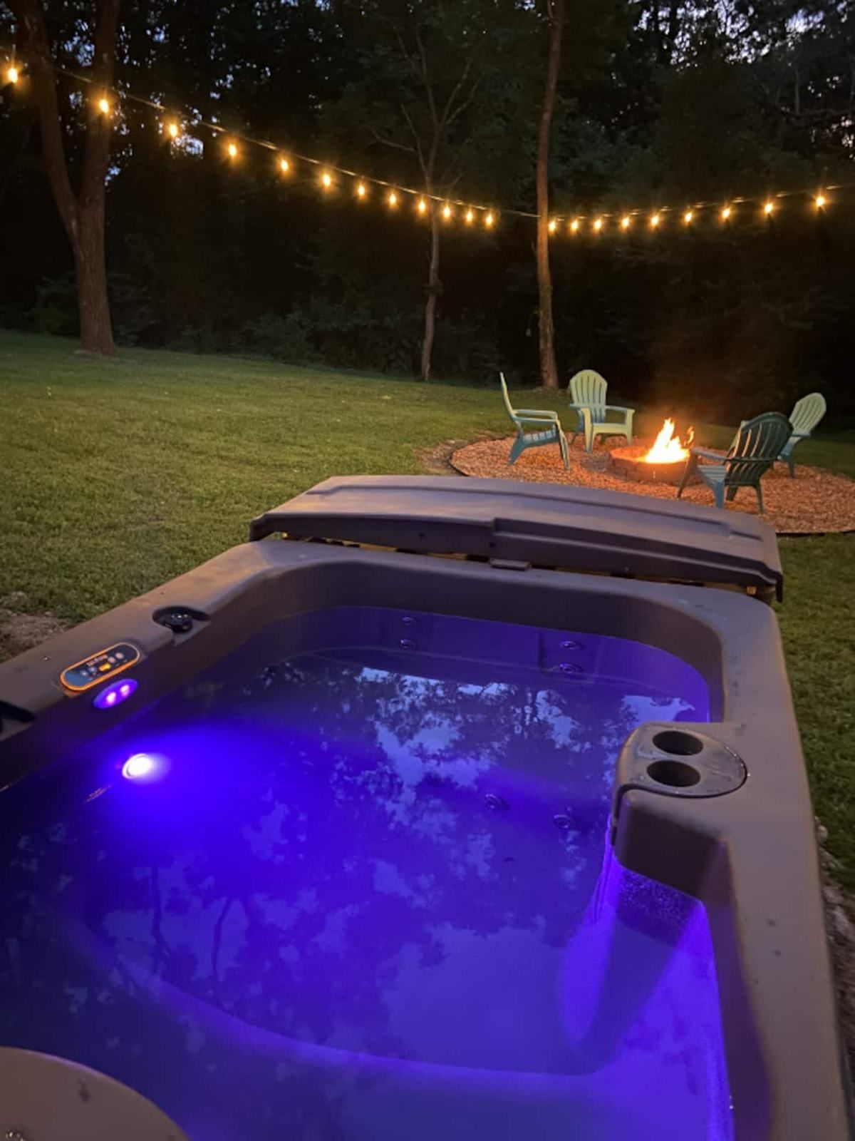 Hot tub lit up at night